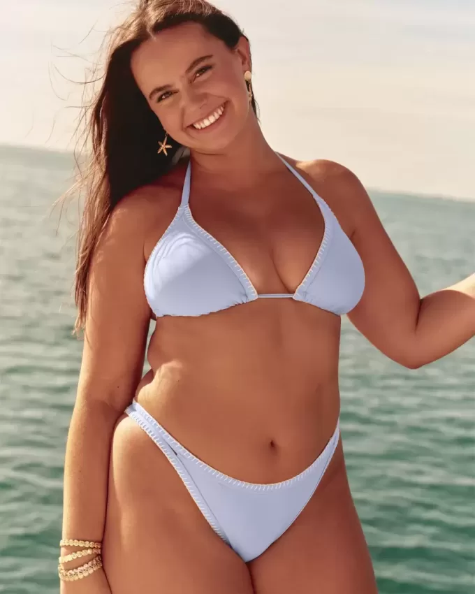 Slip bikini Cheekiest con sgambatura alta e cinturini ricamati Slip bikini Cheekiest con sgambatura alta e cinturini ricamati