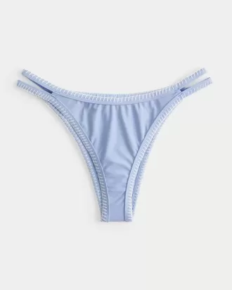Slip bikini Cheekiest con sgambatura alta e cinturini ricamati
