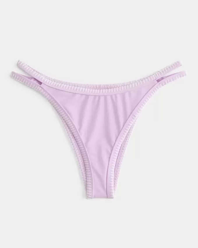 Slip bikini Cheekiest con sgambatura alta e cinturini ricamati Slip bikini Cheekiest con sgambatura alta e cinturini ricamati
