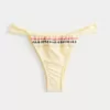 Slip bikini Cheekiest con sgambatura alta e cinturino laterale ricamato Slip bikini Cheekiest con sgambatura alta e cinturino laterale ricamato