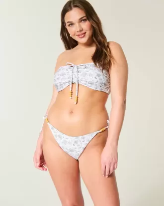 Slip bikini Cheeky reversibile con lacci laterali