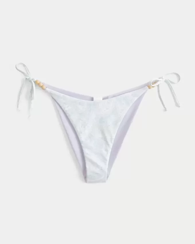 Slip bikini Cheeky reversibile con lacci laterali Slip bikini Cheeky reversibile con lacci laterali