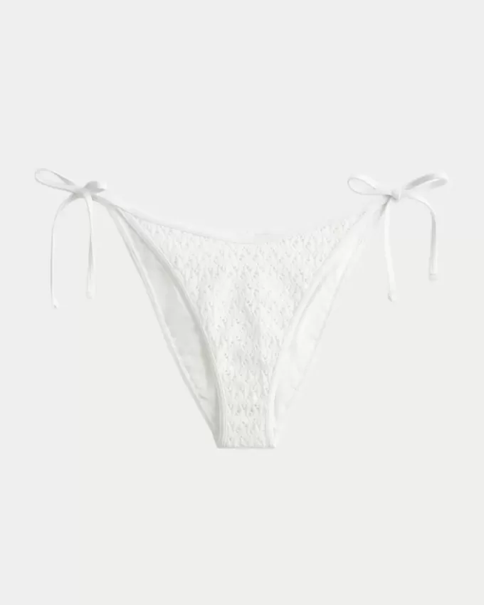 Slip bikini sfacciato con lacci laterali in stile uncinetto con paillettes