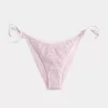 Slip bikini sfacciato con lacci laterali in stile uncinetto con paillettes