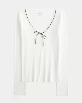 Top a maniche lunghe con pizzo