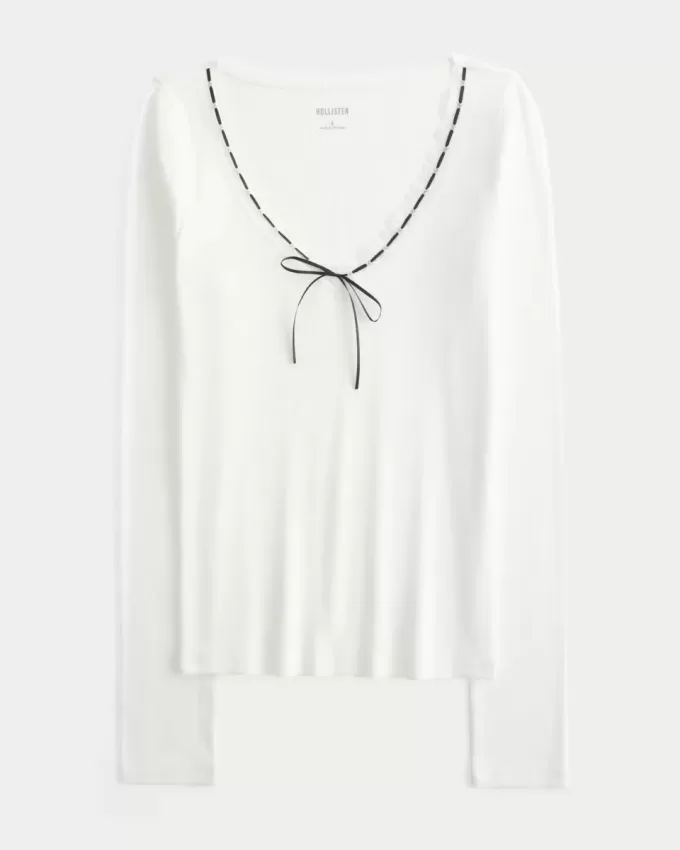 Top a maniche lunghe con pizzo