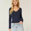 Top a maniche lunghe con pizzo