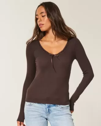 Top a maniche lunghe con pizzo