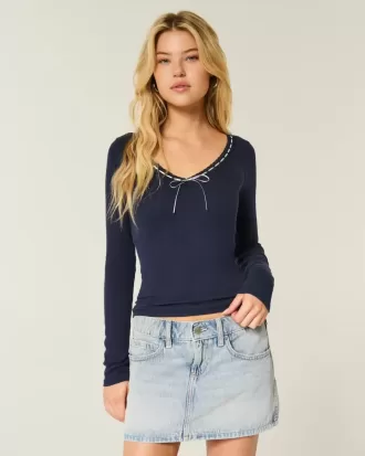 Top a maniche lunghe con pizzo