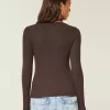 Top a maniche lunghe con pizzo
