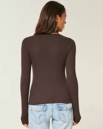 Top a maniche lunghe con pizzo