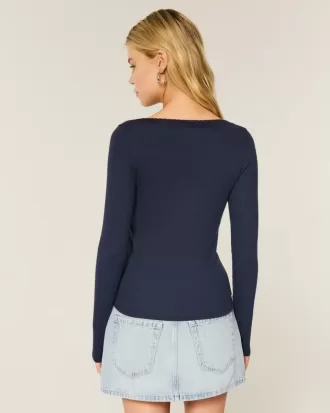 Top a maniche lunghe con pizzo