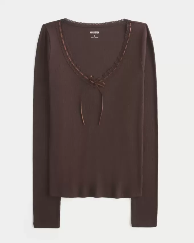 Top a maniche lunghe con pizzo