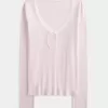 Top a maniche lunghe con pizzo