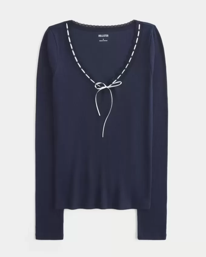 Top a maniche lunghe con pizzo