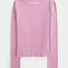 Top a maniche lunghe con scollo a V
