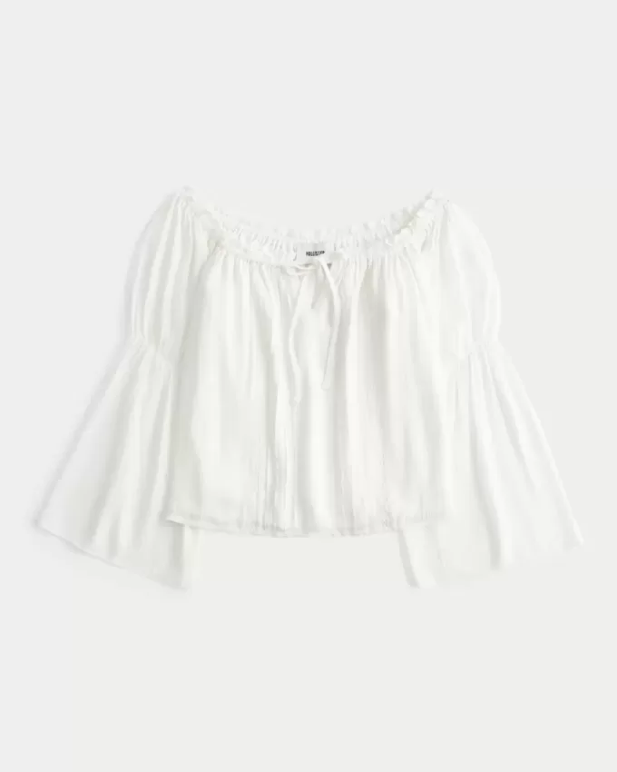 Top a maniche lunghe con spalle scoperte