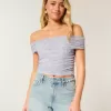 Top a spalle scoperte con scollo a V e scollo a V in rete