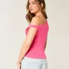 Top asimmetrico con spalle scoperte