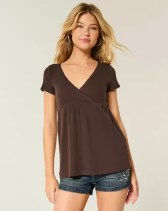 Top babydoll a maniche corte con bordi in pizzo