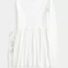 Top babydoll a maniche lunghe con motivo a farfalla