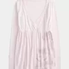 Top babydoll a maniche lunghe con motivo floreale