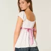 Top babydoll con lacci in raso