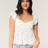 Top babydoll con maniche a sbuffo
