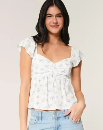 Top babydoll con maniche a sbuffo