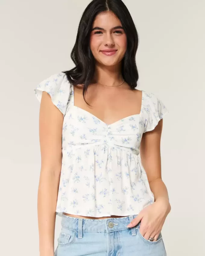 Top babydoll con maniche a sbuffo
