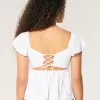 Top babydoll con maniche a sbuffo