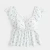 Top babydoll con maniche a sbuffo