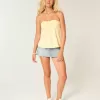 Top babydoll senza spalline con spalline strette