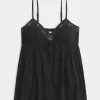 Top babydoll svolazzante e brillante increspato
