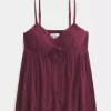 Top babydoll svolazzante e brillante increspato