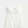 Top babydoll svolazzante e brillante increspato
