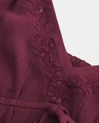 Top babydoll svolazzante e brillante increspato