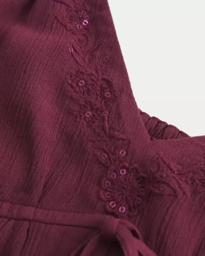 Top babydoll svolazzante e brillante increspato