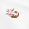 Top con scollo all’americana e grafica con perline Top con scollo all’americana e grafica con perline