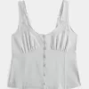 Top in misto lino con bottoni