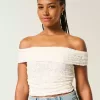 Top in pizzo con scollo a V e spalle scoperte
