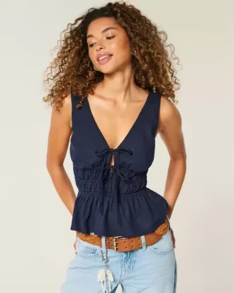 Top peplo con nodo frontale in misto lino
