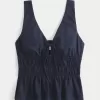 Top peplo con nodo frontale in misto lino